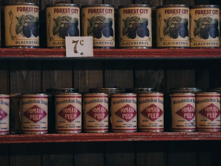 Canned goods on wooden shelves