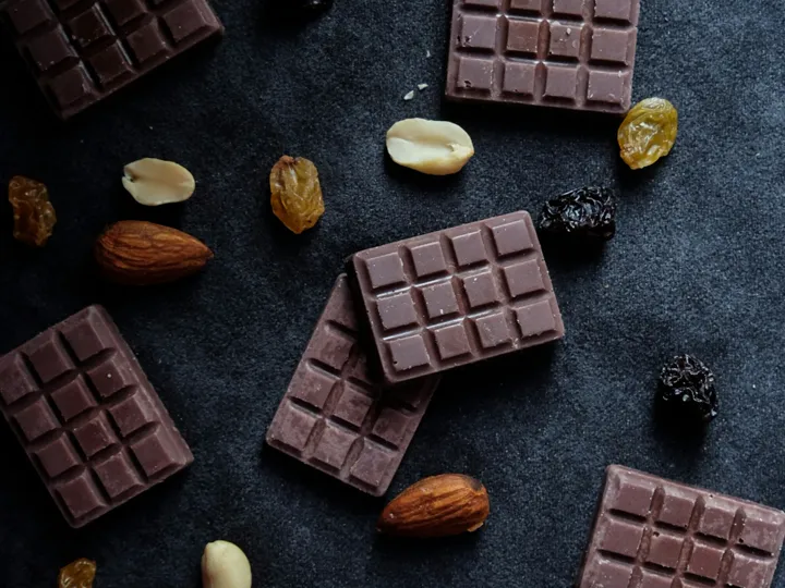 Pieces of chocolate with nuts on a table