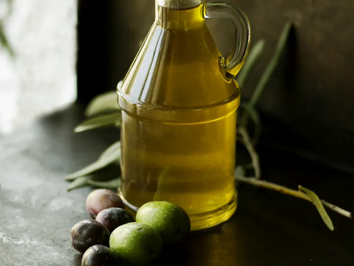 A glass cruet of olive oil